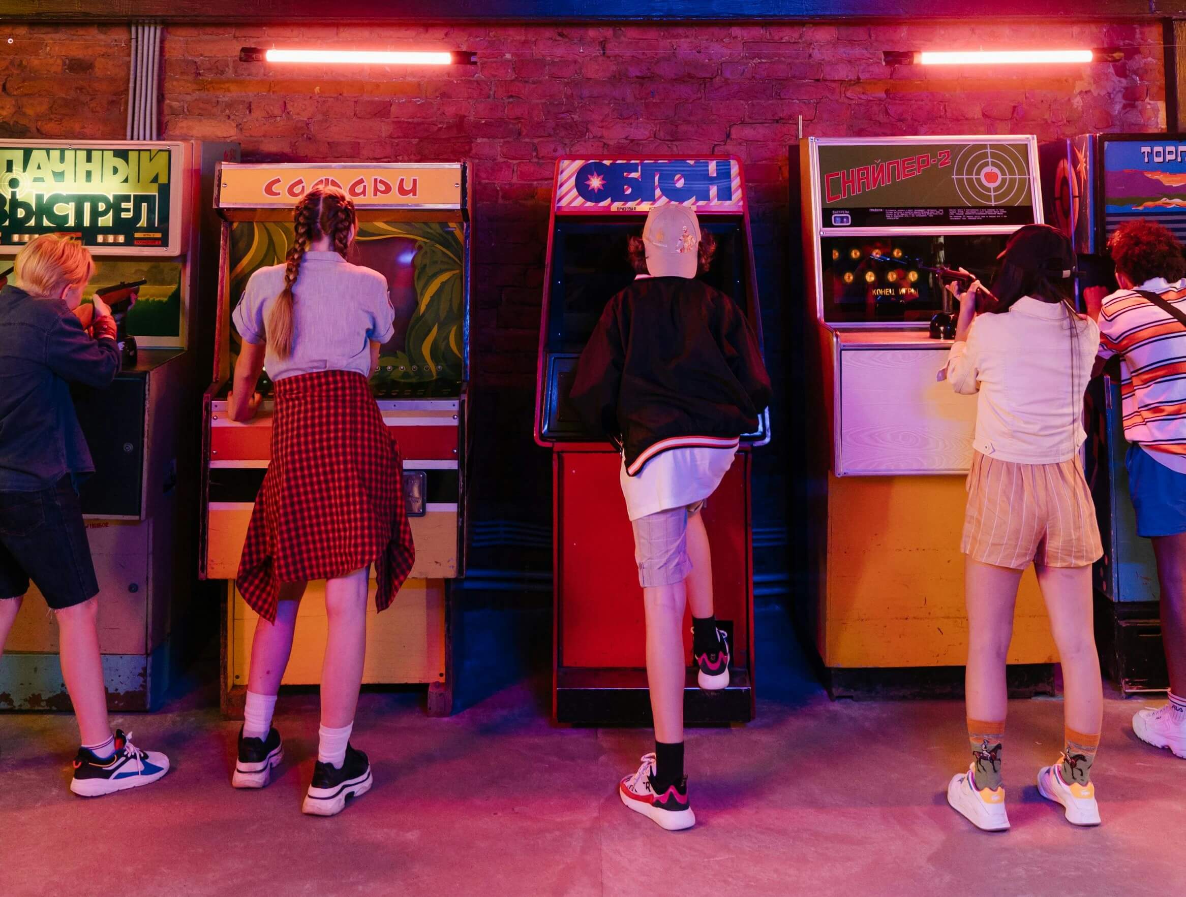 game night table featuring retro games and cassettes, drinks and snacks